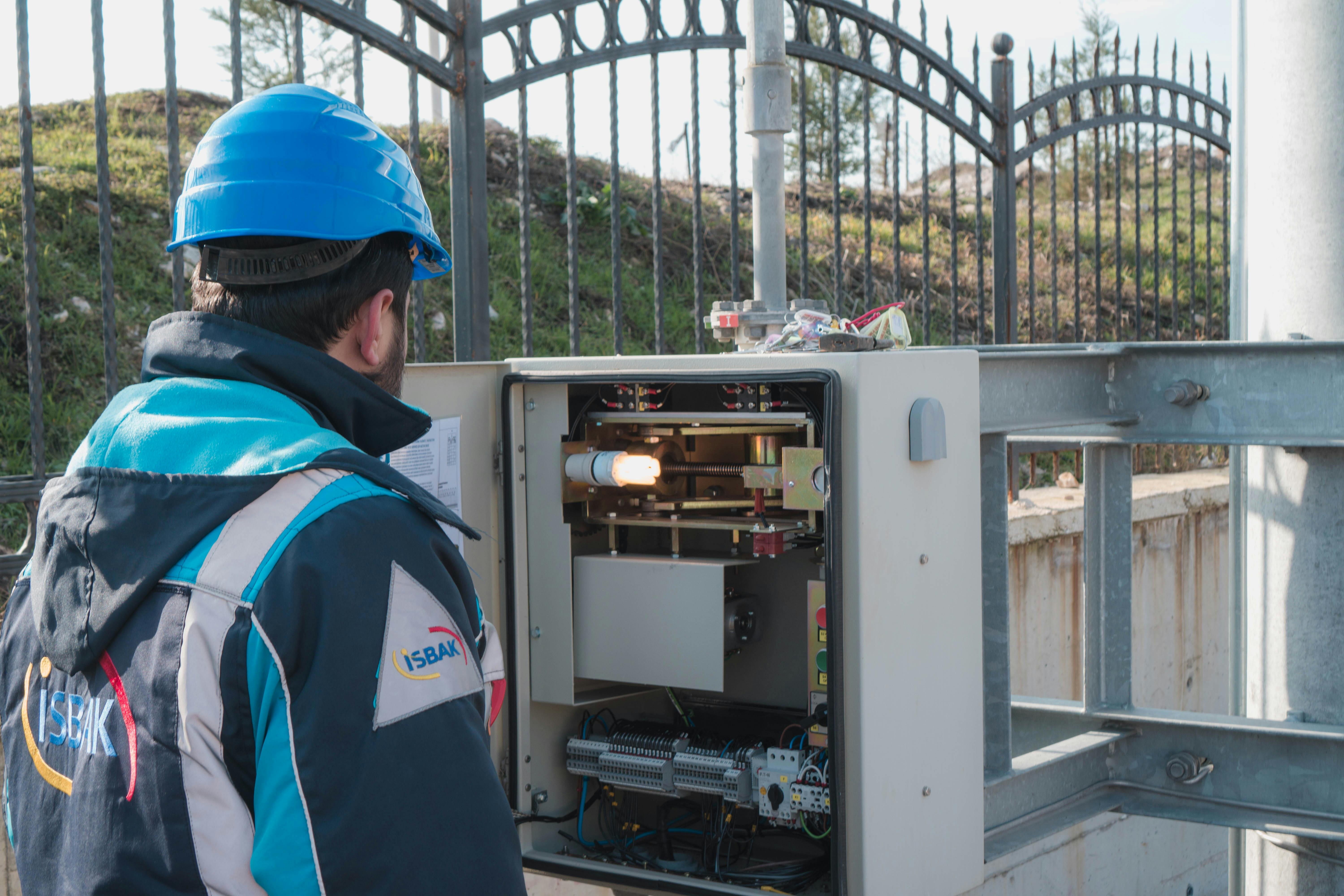 Technician inspecting a field switchboard